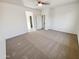 Comfortable bedroom with carpet flooring, ample natural light, and views of the neighborhood at 19904 W Sherman St, Buckeye, AZ 85326