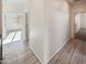 Bright hallway with tile flooring leading to various rooms filled with natural sunlight at 19904 W Sherman St, Buckeye, AZ 85326