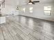 Spacious living room featuring tiled floors, large windows, and abundant natural light at 19904 W Sherman St, Buckeye, AZ 85326