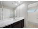 Bright bathroom featuring a single sink vanity, framed mirror and tile flooring at 22193 E Via Del Oro --, Queen Creek, AZ 85142