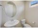 This powder room features pedestal sink and soft natural light at 22193 E Via Del Oro --, Queen Creek, AZ 85142