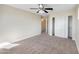 Bright bedroom with carpet, neutral walls, and closet with sliding doors at 22193 E Via Del Oro --, Queen Creek, AZ 85142