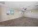 This spacious bedroom features plush carpeting and multiple windows for natural light at 22193 E Via Del Oro --, Queen Creek, AZ 85142