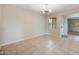 Empty dining room with tile flooring, chandelier, and a window offering natural light at 22193 E Via Del Oro --, Queen Creek, AZ 85142