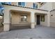 Entrance featuring a covered porch area with metal railing, and a black front door at 22193 E Via Del Oro --, Queen Creek, AZ 85142