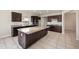 Kitchen with dark wood cabinets, granite countertops, and stainless steel appliances at 22193 E Via Del Oro --, Queen Creek, AZ 85142