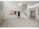 Large living room boasts tall ceilings, tiled floors, and views to the kitchen at 22193 E Via Del Oro --, Queen Creek, AZ 85142