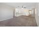 Upstairs loft space with carpeting, a ceiling fan, and a light and airy feel at 22193 E Via Del Oro --, Queen Creek, AZ 85142
