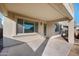 Covered patio with beige concrete and an attached wooden deck with a small table and chairs at 22193 E Via Del Oro --, Queen Creek, AZ 85142