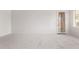 Bright bedroom features carpet floors, a blank wall and an exterior door at 279 W Stirrup Ln, San Tan Valley, AZ 85143