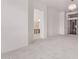 Open bedroom with carpet floors, recessed lighting and a doorway to the bathroom at 279 W Stirrup Ln, San Tan Valley, AZ 85143
