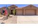 Attractive home with a two car garage and desert landscaping at 279 W Stirrup Ln, San Tan Valley, AZ 85143