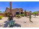 Charming desert-landscaped front yard featuring mature cacti and rock accents at 279 W Stirrup Ln, San Tan Valley, AZ 85143