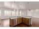 Bright kitchen featuring quartz countertops and stainless steel appliances at 279 W Stirrup Ln, San Tan Valley, AZ 85143