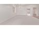 Spacious room with modern lighting, light-colored carpet, and large window, creating a cozy atmosphere at 279 W Stirrup Ln, San Tan Valley, AZ 85143
