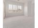 Living room with carpet floors and large window at 279 W Stirrup Ln, San Tan Valley, AZ 85143