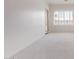 Living room with large windows and a door to the outside at 279 W Stirrup Ln, San Tan Valley, AZ 85143