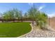 Lush backyard showcasing manicured turf and stone landscaping at 2934 S Woodruff Cir, Mesa, AZ 85212