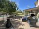 Outdoor patio with comfortable seating and lush landscaping, perfect for relaxation and entertaining at 2934 S Woodruff Cir, Mesa, AZ 85212
