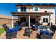 The covered patio features comfortable seating for enjoying the outdoors at 2934 S Woodruff Cir, Mesa, AZ 85212