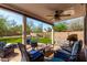 Relaxing backyard patio with comfortable seating and a view of the green lawn at 2934 S Woodruff Cir, Mesa, AZ 85212