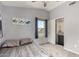 Neutral bedroom with a ceiling fan, cozy bed, window, and closet space at 2934 S Woodruff Cir, Mesa, AZ 85212