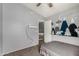 Bedroom features a playful mountain wall mural and a view to a staircase at 2934 S Woodruff Cir, Mesa, AZ 85212