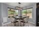 Dining room with a modern light fixture and view of the backyard at 2934 S Woodruff Cir, Mesa, AZ 85212