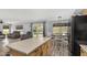 Open-concept kitchen and dining area with stainless steel appliances, and backyard access at 2934 S Woodruff Cir, Mesa, AZ 85212
