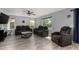 Comfortable living room featuring plush sofas and a modern marble coffee table at 2934 S Woodruff Cir, Mesa, AZ 85212