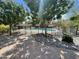 Fenced pool surrounded by trees, offering a secure and scenic backyard oasis at 2934 S Woodruff Cir, Mesa, AZ 85212
