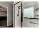 Modern tiled shower with a rainfall showerhead, a window, and glass enclosure at 2934 S Woodruff Cir, Mesa, AZ 85212