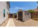 Durable storage shed in backyard, providing ample space for outdoor equipment at 2934 S Woodruff Cir, Mesa, AZ 85212