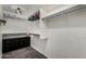 Walk-in closet featuring built-in shelves, hanging rods, and a built-in dresser at 2934 S Woodruff Cir, Mesa, AZ 85212
