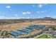 Wide aerial view of desert sports park featuring tennis courts, roadways, and tranquil mountain background at 3010 E Fruitvale Ave, Gilbert, AZ 85297