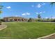 Sprawling backyard features lush grass and a custom volleyball court at 3010 E Fruitvale Ave, Gilbert, AZ 85297