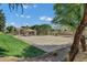 Outdoor basketball court at neighborhood park with picnic table, shady trees, and well-maintained grounds at 3010 E Fruitvale Ave, Gilbert, AZ 85297