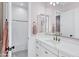 Bright bathroom featuring white cabinets, marbled counters, and a decorative shower curtain at 3010 E Fruitvale Ave, Gilbert, AZ 85297