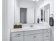 Bright bathroom boasts a white vanity with silver hardware, and a large mirror at 3010 E Fruitvale Ave, Gilbert, AZ 85297
