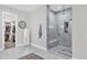 Bathroom with a walk-in shower, a tiled wall, and access to a large walk-in closet at 3010 E Fruitvale Ave, Gilbert, AZ 85297