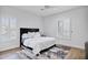Bedroom features a dark bed frame with a plush rug and natural light from shuttered windows at 3010 E Fruitvale Ave, Gilbert, AZ 85297
