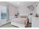 Bedroom featuring a bed, large window, and decorative wall art at 3010 E Fruitvale Ave, Gilbert, AZ 85297