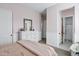 Bedroom with beadboard walls, a dresser, and access to the bathroom at 3010 E Fruitvale Ave, Gilbert, AZ 85297