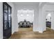 A dining room with a dining table and chandelier, as seen from an entrance hallway at 3010 E Fruitvale Ave, Gilbert, AZ 85297