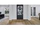 A wide entryway with hardwood floors, neutral walls, and a large window at 3010 E Fruitvale Ave, Gilbert, AZ 85297
