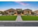 Charming single-story home with well-manicured lawn, tasteful landscaping, and inviting curb appeal at 3010 E Fruitvale Ave, Gilbert, AZ 85297