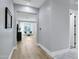 Hallway with hardwood floors leading to a sitting room at 3010 E Fruitvale Ave, Gilbert, AZ 85297