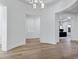 Hallway featuring hardwood floors, curved archways, and modern lighting at 3010 E Fruitvale Ave, Gilbert, AZ 85297