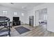 Spacious home gym featuring a TV, fan and access to a bedroom, perfect for fitness enthusiasts at 3010 E Fruitvale Ave, Gilbert, AZ 85297