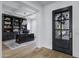 This home office features custom built-in shelving and a large wooden executive desk with a modern light fixture at 3010 E Fruitvale Ave, Gilbert, AZ 85297